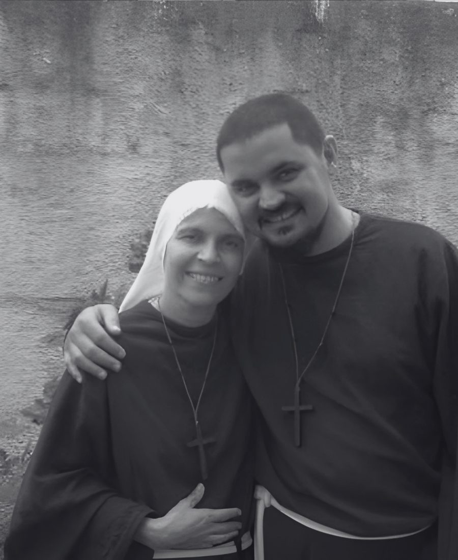 Friar and sister comforting a man on the street