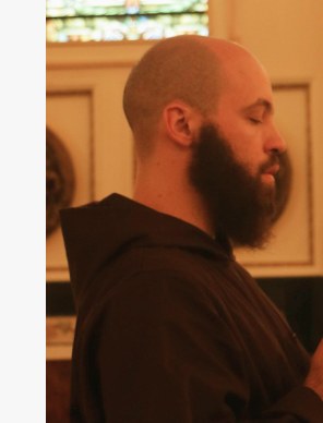 A friar reading the Scriptures