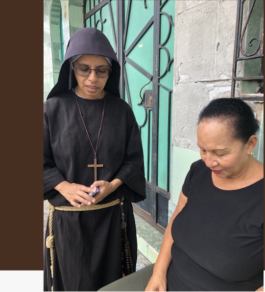 A sister listening to a woman on the street